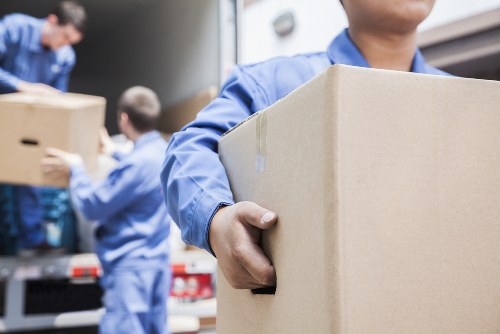 Packed moving boxes and furniture ready for house removals in Northolt