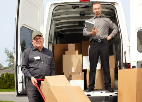 Careful loading of furniture into a removals vehicle in Northolt