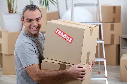 Professional flat removals planning in Northolt with moving boxes